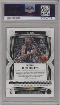 Mikal Bridges from the 2023-24 Panini Obsidian set featuring a Electric Etch Gold Flood parallel graded by PSA and given an overall grade of 10.