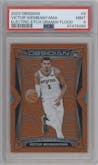 Victor Wembanyama from the 2023-24 Panini Obsidian set featuring a Electric Etch Orange Flood parallel graded by PSA and given an overall grade of 9.