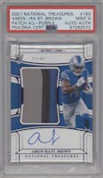 Amon-Ra St. Brown from the 2021 Panini National Treasures set featuring a Purple parallel graded by PSA and given an overall grade of 9.