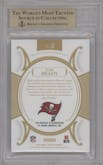 Tom Brady from the 2020 Panini Flawless set featuring a Emeralds parallel graded by Beckett and given an overall grade of 9.5.