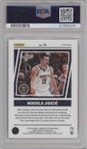 Nikola Jokic from the 2022-23 Panini Donruss Optic  set featuring a Red parallel graded by PSA and given an overall grade of 10.