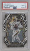Aaron Rodgers from the 2022 Panini Select set featuring a Die-Cut Zebra parallel graded by PSA and given an overall grade of 10.