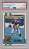 Troy Aikman from the 1990 Topps set featuring a Tiffany parallel graded by PSA and given an overall grade of 9.