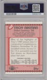 Troy Aikman from the 1990 Topps set featuring a Tiffany parallel graded by PSA and given an overall grade of 9.