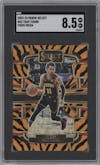 Trae Young from the 2023-24 Panini Select  set featuring a Tiger parallel graded by SGC and given an overall grade of 8.5.