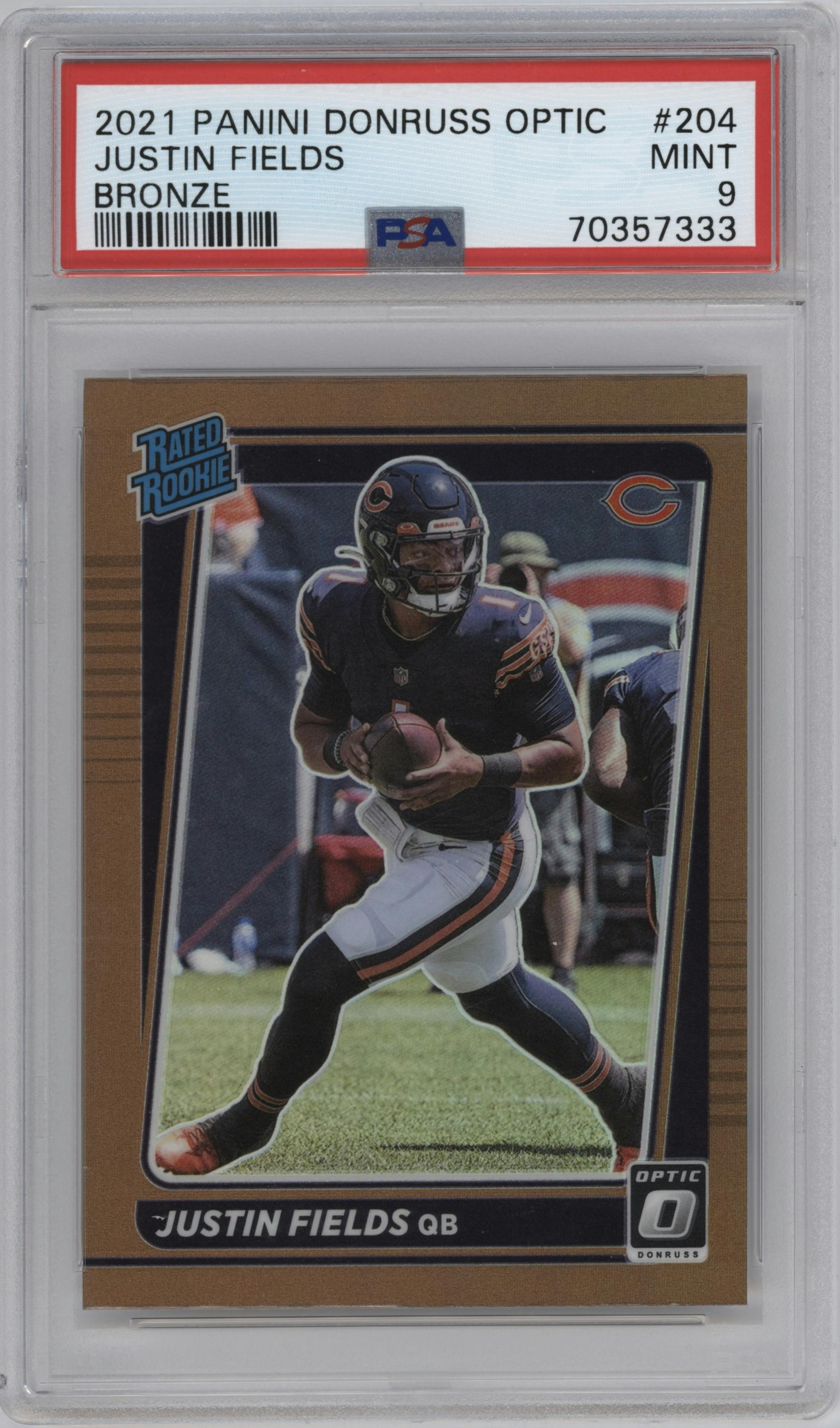 Justin Fields from the 2021 Panini Donruss Optic set featuring a Bronze parallel graded by PSA and given an overall grade of 9.