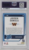 Jayden Daniels from the 2024 Donruss set featuring a Press Proof Blue parallel graded by PSA and given an overall grade of 9.