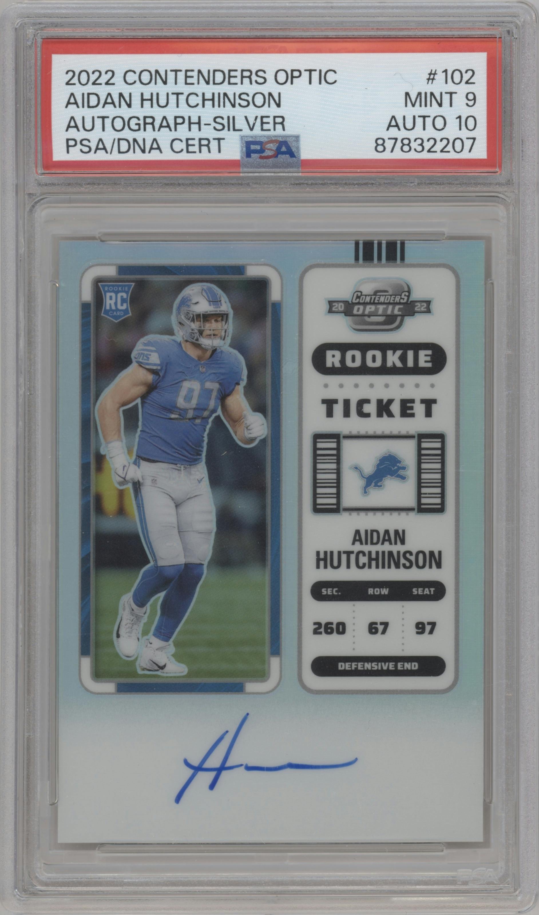 Aidan Hutchinson from the 2022 Panini Contenders Optic set featuring a Silver parallel graded by PSA and given an overall grade of 9.