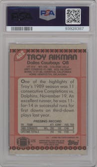 Troy Aikman from the 1990 Topps set graded by PSA and given an overall grade of 9.