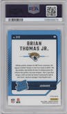 Brian Thomas Jr. from the 2024 Donruss set featuring a Red Pandora parallel graded by PSA and given an overall grade of 9.