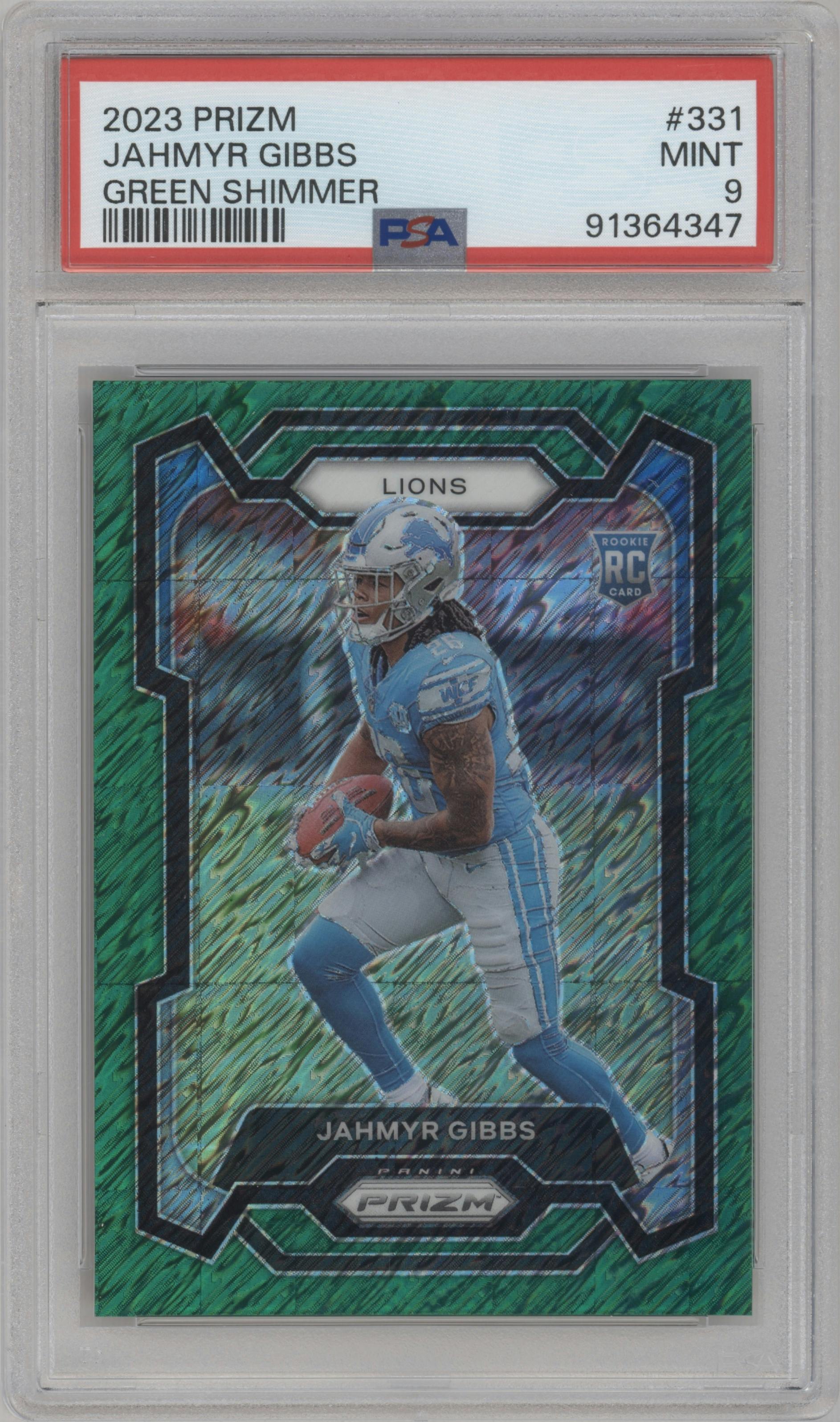 Jahmyr Gibbs from the 2023 Panini Prizm set featuring a Green Shimmer parallel graded by PSA and given an overall grade of 9.