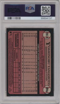  Yoshinobu Yamamoto from the 2024 Topps Series 2 Silver Pack set featuring a Orange parallel graded by PSA and given an overall grade of 9.
