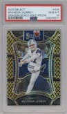 Brandon Aubrey from the 2023 Panini Select set featuring a Gold Dragon Scale parallel graded by PSA and given an overall grade of 10.